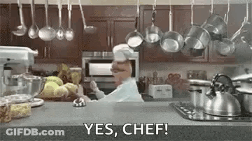 Chef Saying Yes Chef With Hanging Pots Pans GIF
