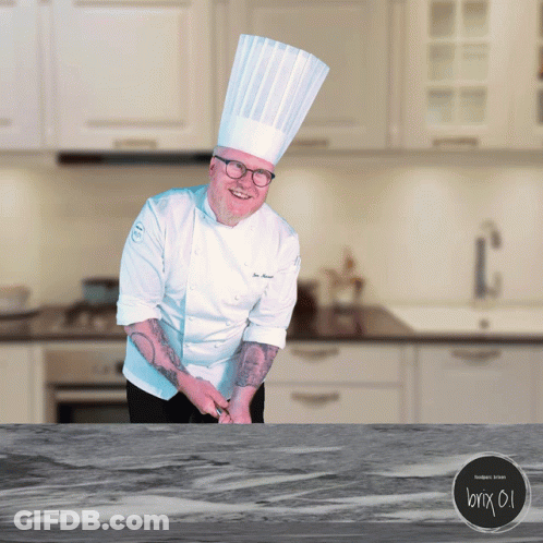 Chef Standing At Kitchen Counter GIF