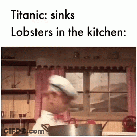 Chef Standing In Kitchen With Pot Of Lobsters GIF