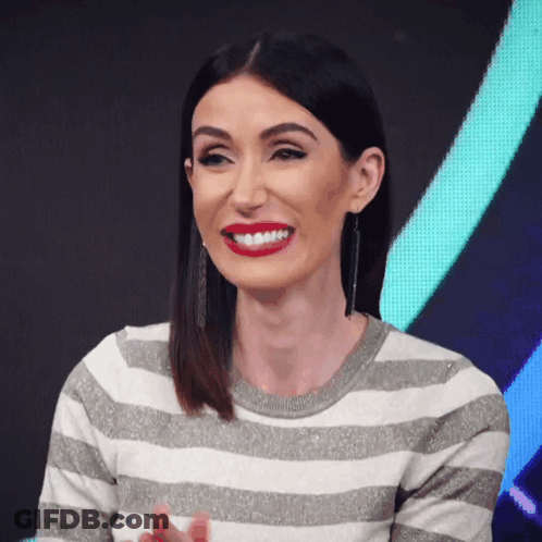 Cher At Table With Cher Sign GIF