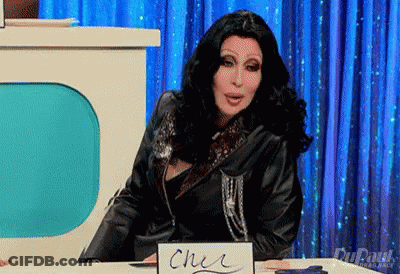 Cher At Table With Cher Sign GIF