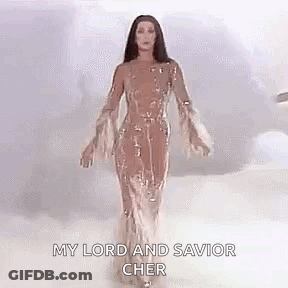 Cher In Long Dress With Arms Outstretched In Clouds GIF