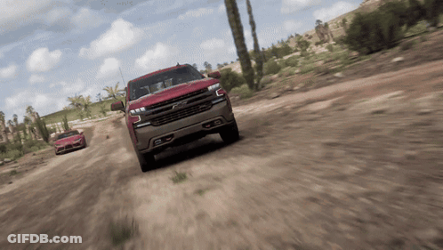 Chevrolet Truck Driving Down Dirt Road GIF