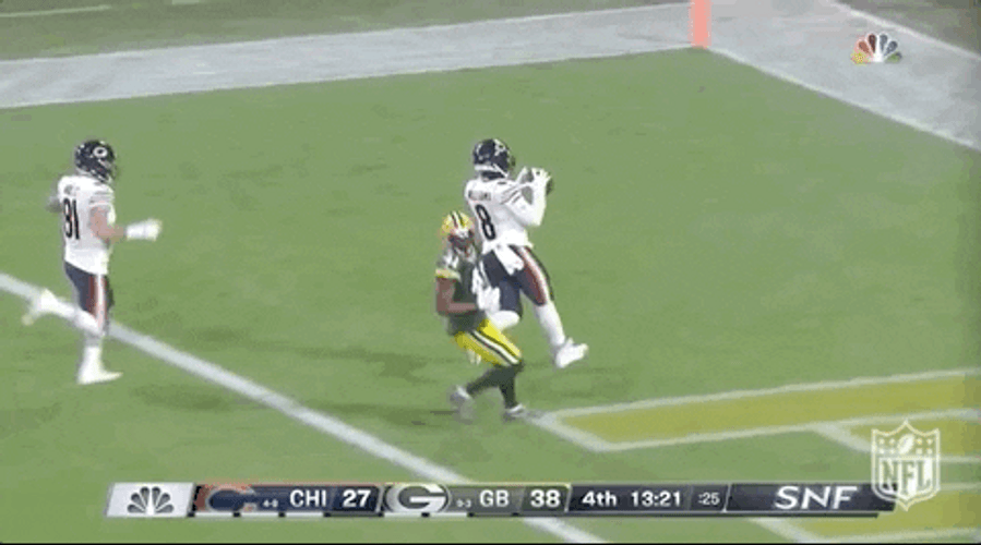 Chicago Bear Players Chasing Down Football GIF