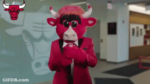 Chicago Bulls Mascot In Front Of Bull Logo GIF