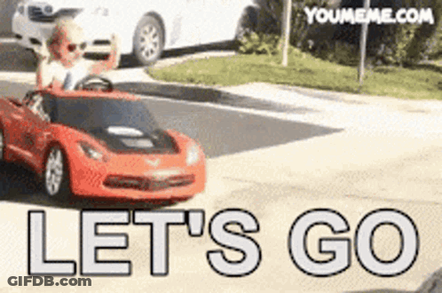 Child Driving Red Toy Car Saying Let's Go GIF