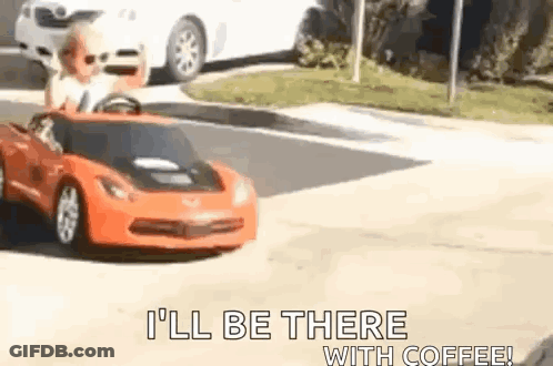 Child Driving Toy Car Down Street GIF