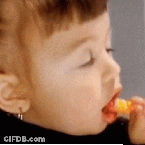 Child Eating Lollipop With Spoon GIF