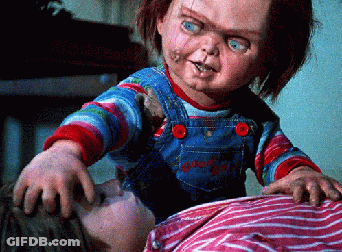 Child Laying On Bed With Chucky Doll GIF