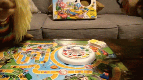 Child Playing Board Game With Box GIF
