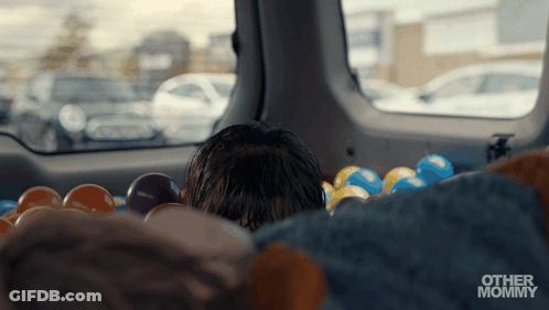 Child Playing In Ball Pit With Other Mommy GIF