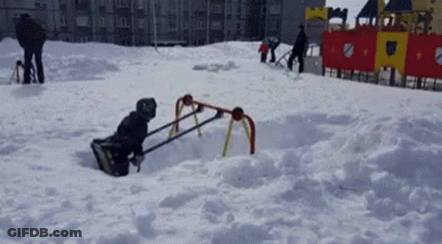 Child Playing In Snow With Snow Plow GIF