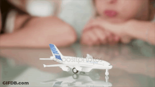 Child Playing With Model Airplane GIF