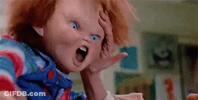 Child's Doll Mouth Open Hand On Head GIF