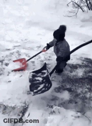 Child Shoveling Snow With Shovel And Hose GIF