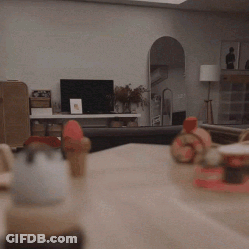 Child Sitting At Table With Toys GIF