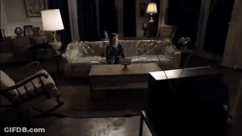Child Sitting On Couch Covered In Plastic Wrap GIF