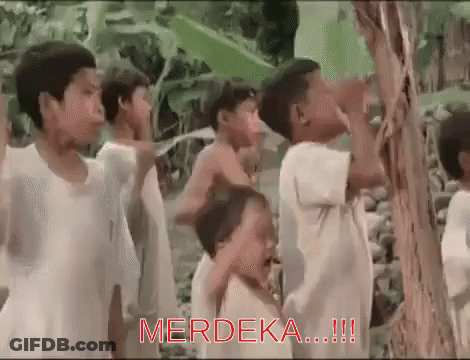 Children Around Tree With Merdeka In Red GIF