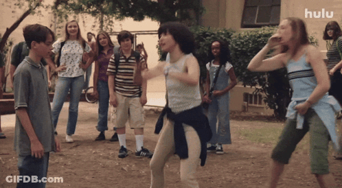 Children Dancing In Front Of Hulu Building GIF