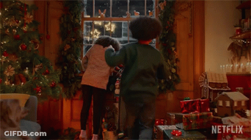 Children Looking Out Window At Christmas Tree GIF