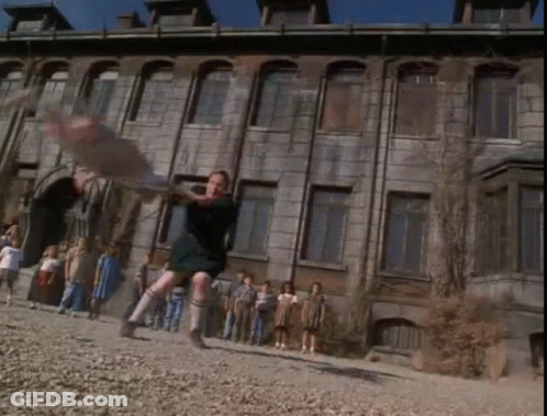 Children Playing In Front Of Old Building GIF
