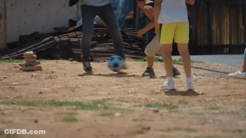 Children Playing Soccer In Dirt GIF