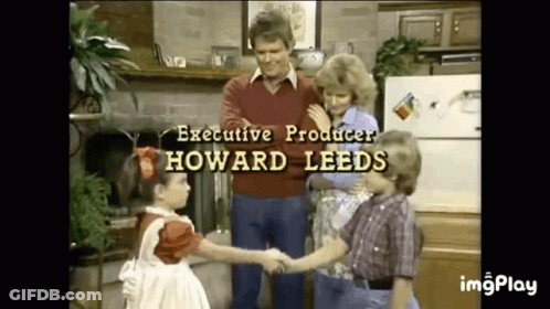 Children Shaking Hands With Man In Kitchen GIF