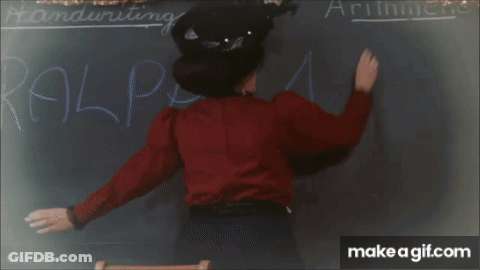 Children Sitting At Desks In Classroom GIF