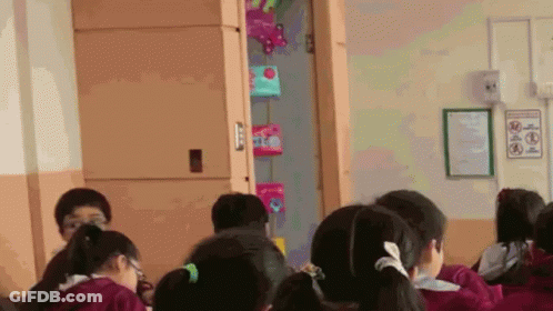 Children Sitting In Classroom With No Smoking Sign GIF