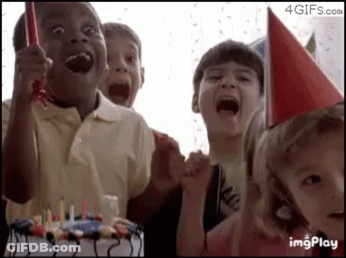 Children Sitting In Front Of Birthday Cake GIF