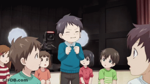 Children Standing Around Boy In Blue Shirt GIF