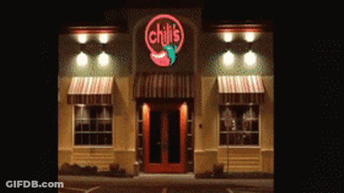 Chili's Restaurant With Red Door And Awnings GIF