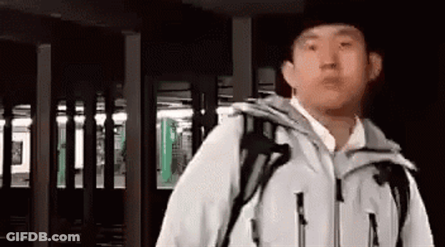 Chinese Man Wearing Jacket Says Okay GIF