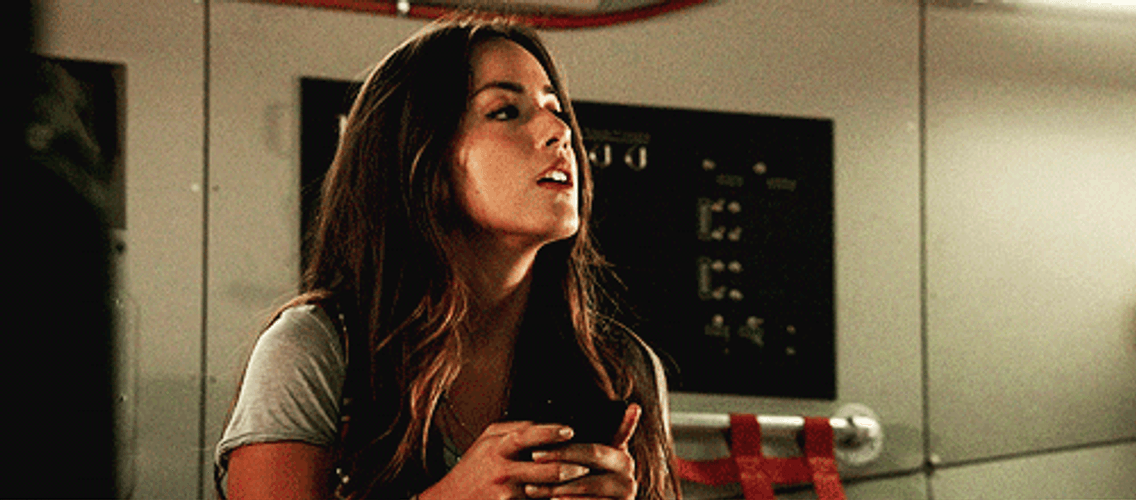 Chloe Bennet Gazing At The Passing Man GIF