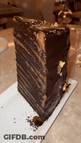 Chocolate Cake Slice With Gold Leaf GIF