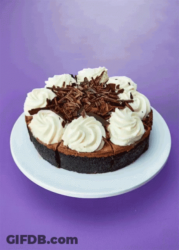 Chocolate Cake With Whipped Cream And Chocolate Shavings GIF