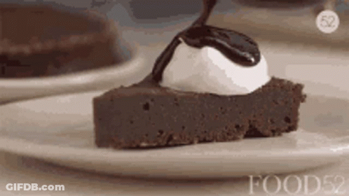 Chocolate Cake With Whipped Cream And Sauce GIF