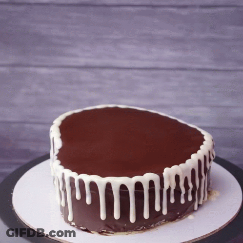 Chocolate Cake With White Frosting Drips GIF