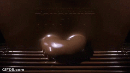 Chocolate Glazed Doughnut Poured Into Tray GIF