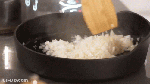 Chopped Onions Stirred With Wooden Spoon GIF