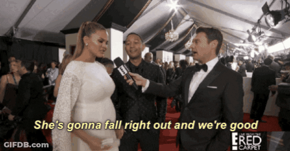 Chrissy Teigen Flexing Pregnant Belly At Red Carpet GIF