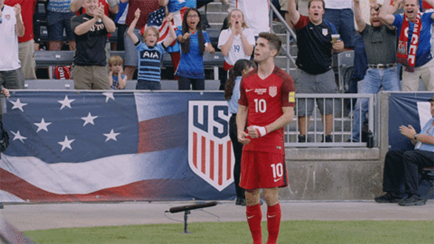 Christian Pulisic Arms Stretched Walking Away GIF