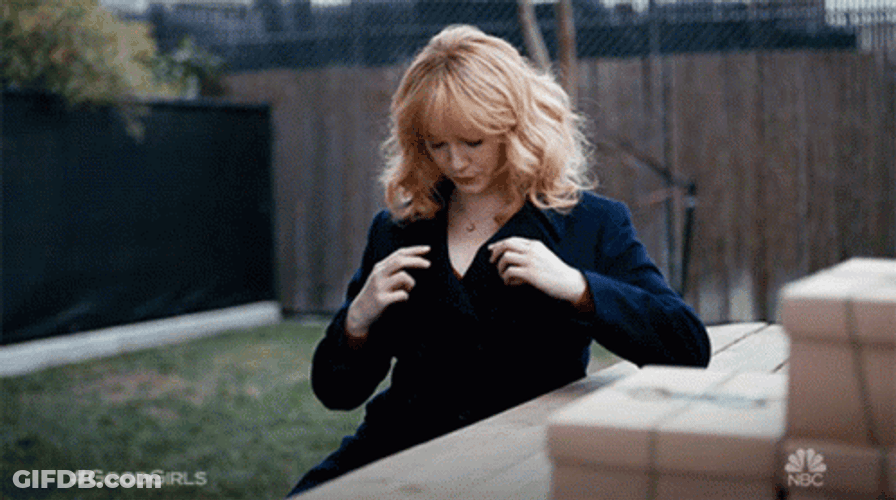 Christina Hendricks Fixing Herself And Do Sexy Postures GIF