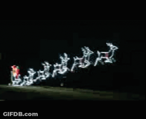 Christmas Sleigh Pulled By Reindeer In Dark GIF