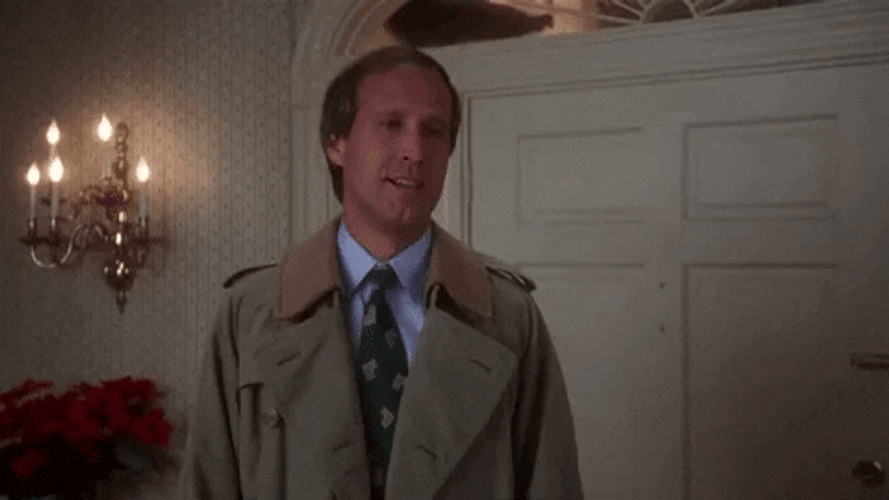 Christmas Vacation Clark Griswold Shrug GIF