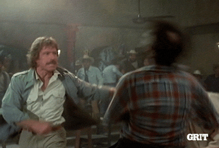 Chuck Norris Doing Round Kick To Opponent GIF