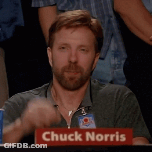 Chuck Norris Is Giving A Thumbs Up In Front Of A Crowd GIF