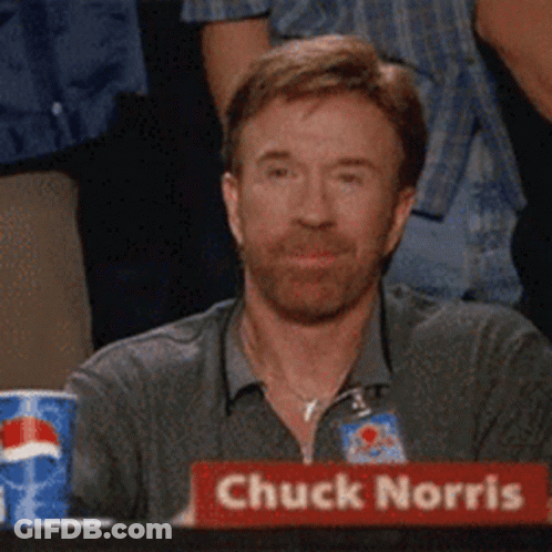 Chuck Norris Is Sitting At A Table With A Pepsi Can In The Background GIF