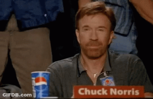 Chuck Norris Is Sitting At A Table With A Pepsi Cup In Front Of Him GIF