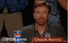 Chuck Norris Is Sitting At A Table With A Pepsi Cup In Front Of Him GIF